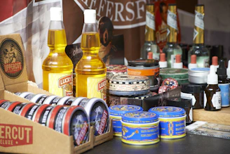 yellow plastic bottle beside blue can