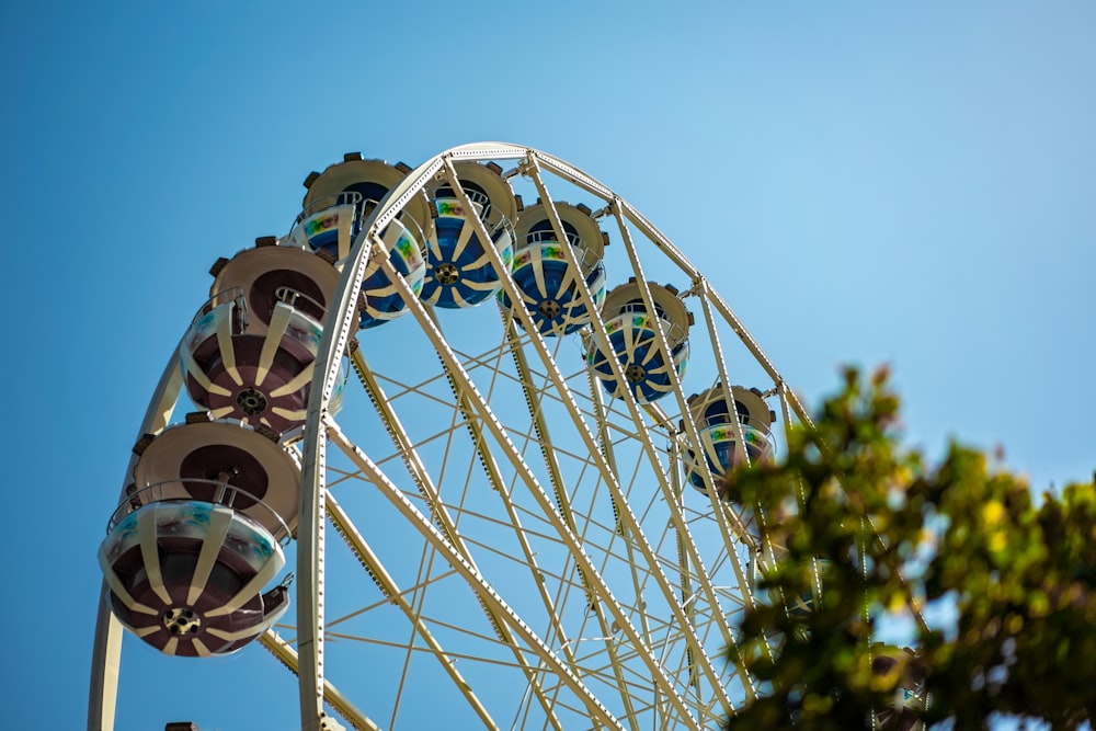 white ferris wheel under blue sky during daytime