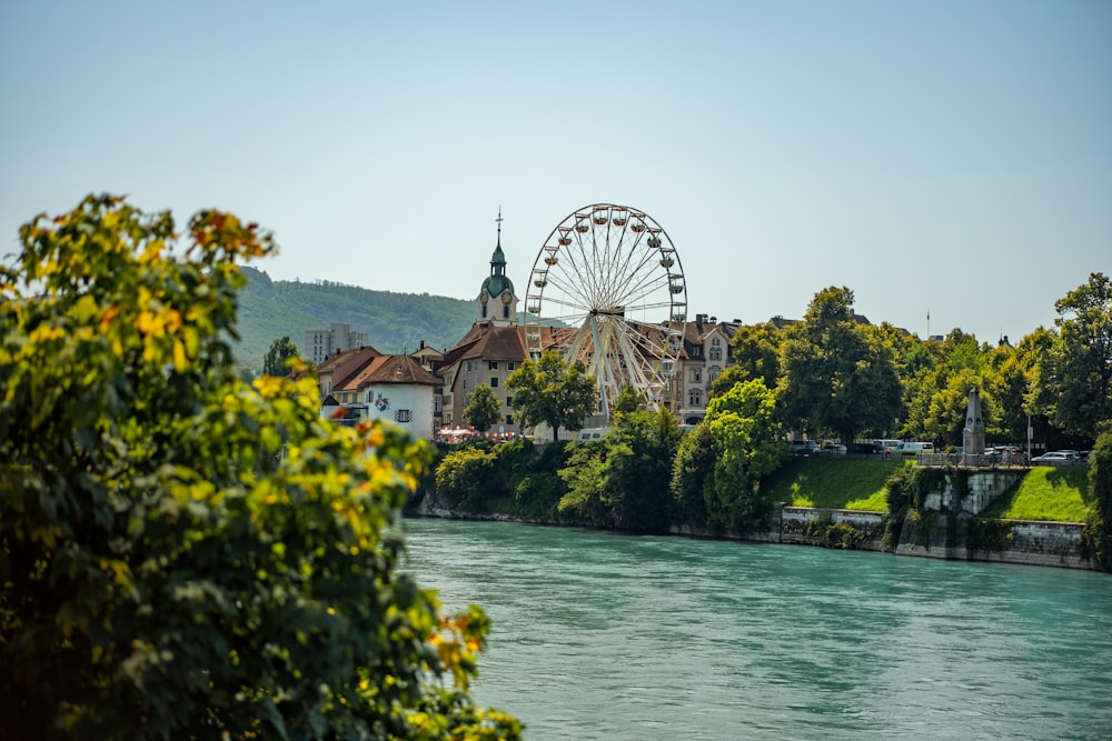 ferris wheel beside body of water during daytime