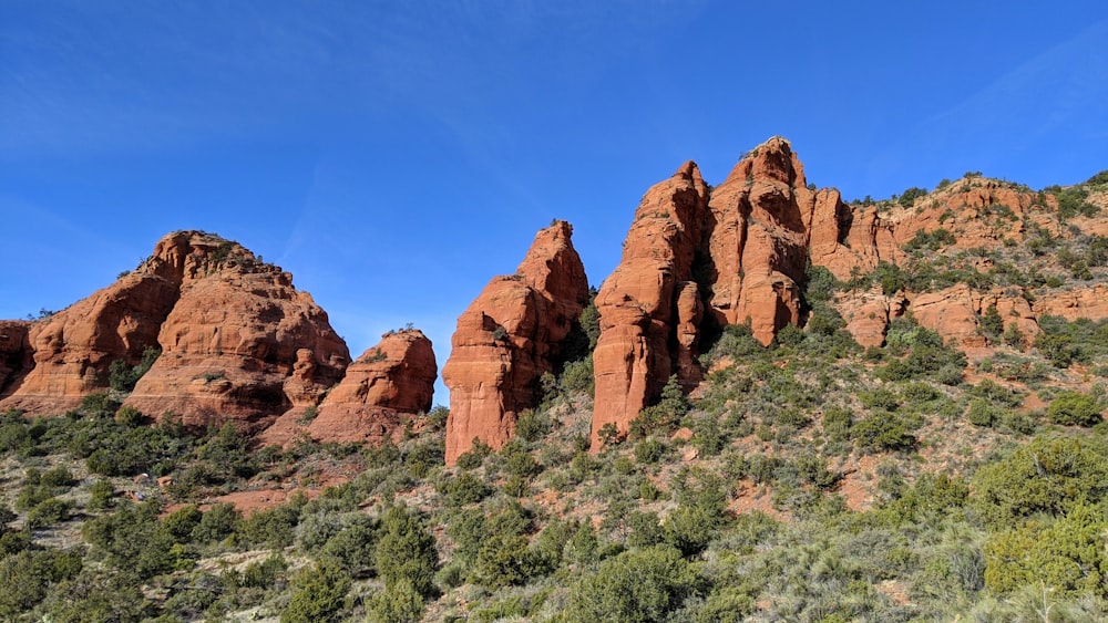 brown rock formation under blue sky during daytime