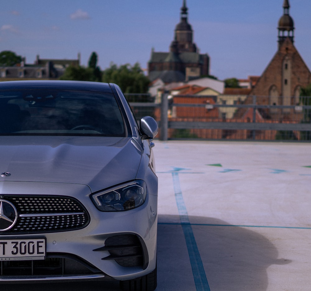 white audi a 4 on road during daytime