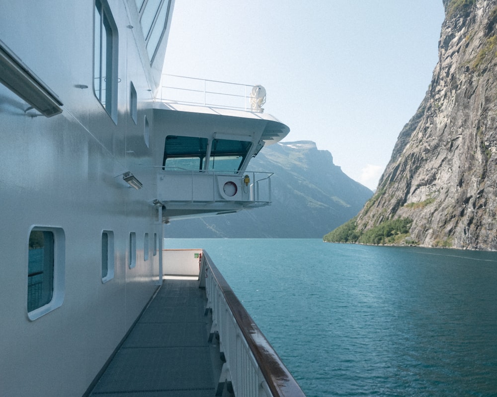 white boat on body of water during daytime