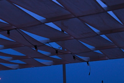 Sturdy event structures assembled with precision under evening lights.