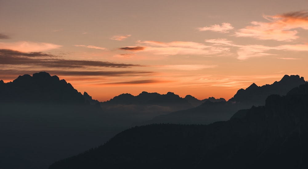 silhouette of mountains during sunset