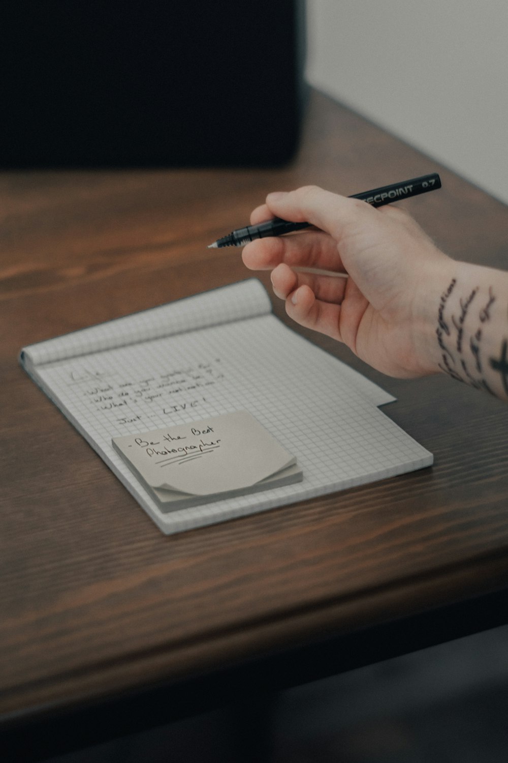 person writing on white paper