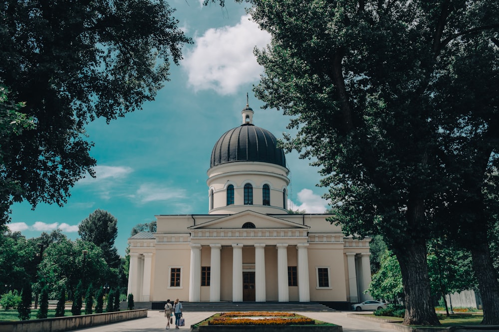 white and green dome building under blue sky during daytime