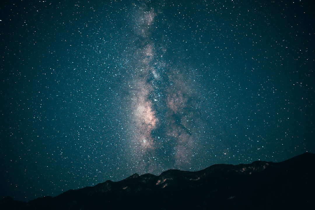 silhouette of mountain under blue sky