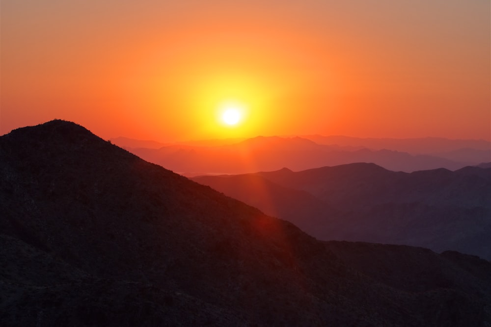 silhouette of mountains during sunset