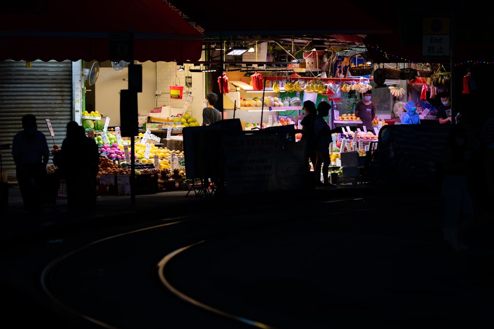 people walking on street during night time