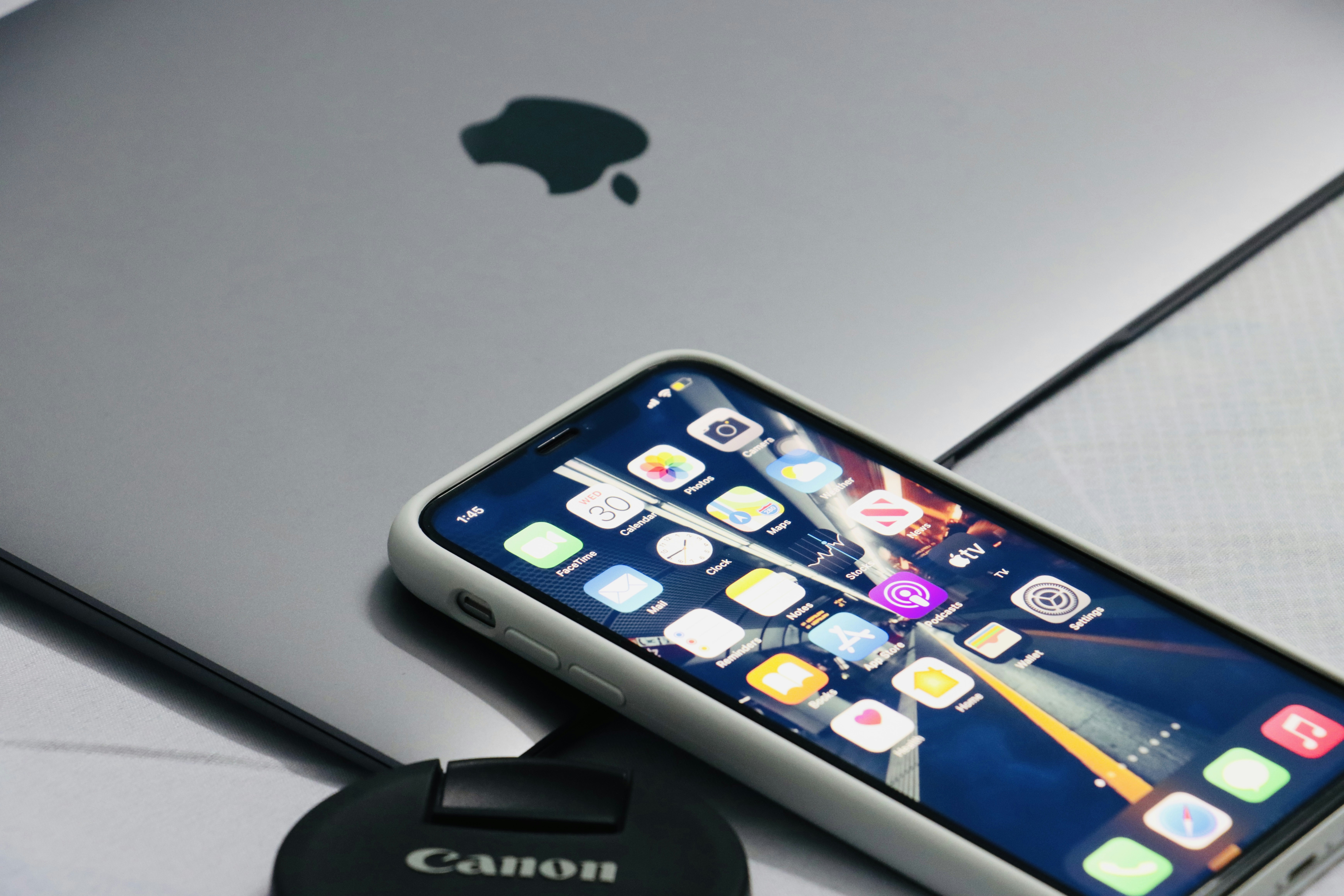 a close up of a cell phone near a charger