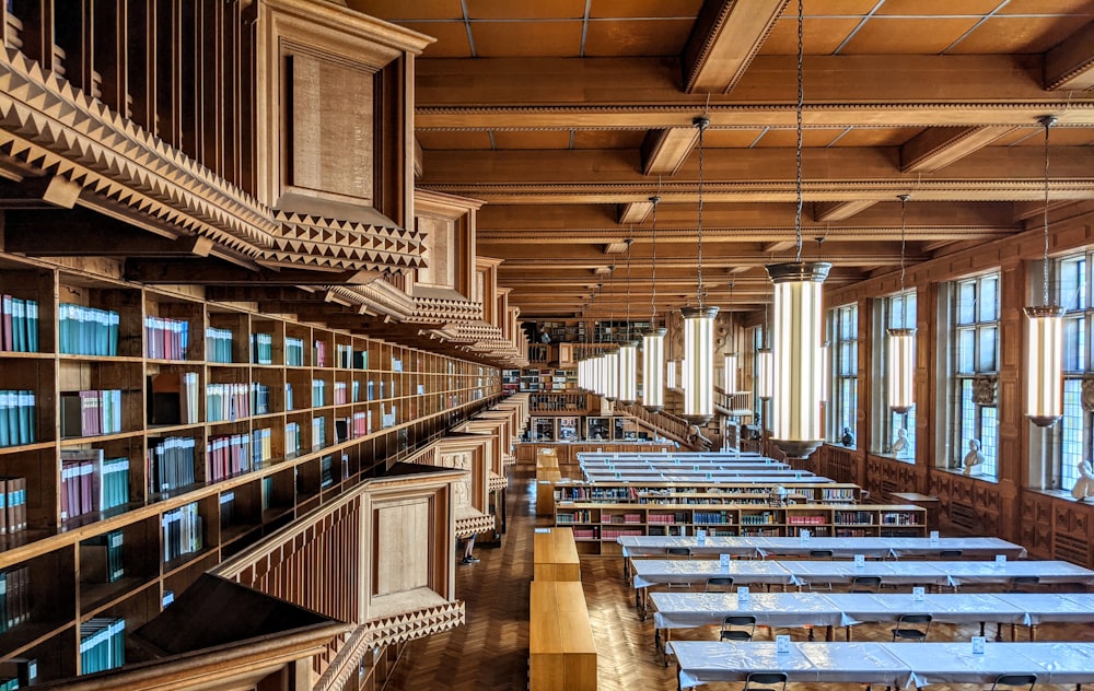 brown wooden book shelves in library