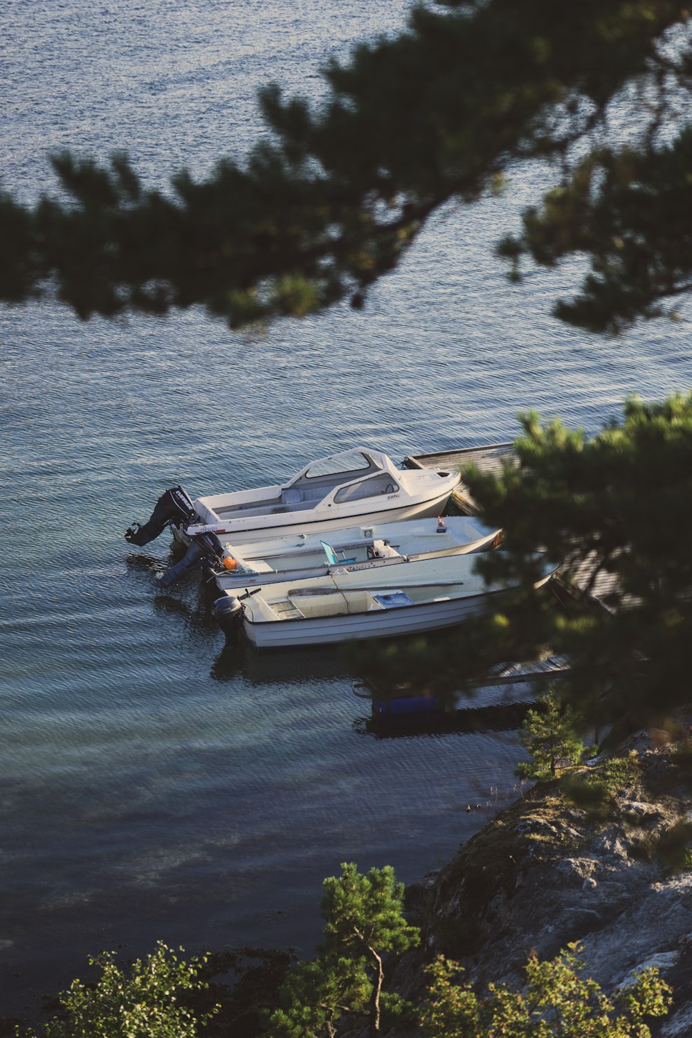 white and black boat on water during daytime