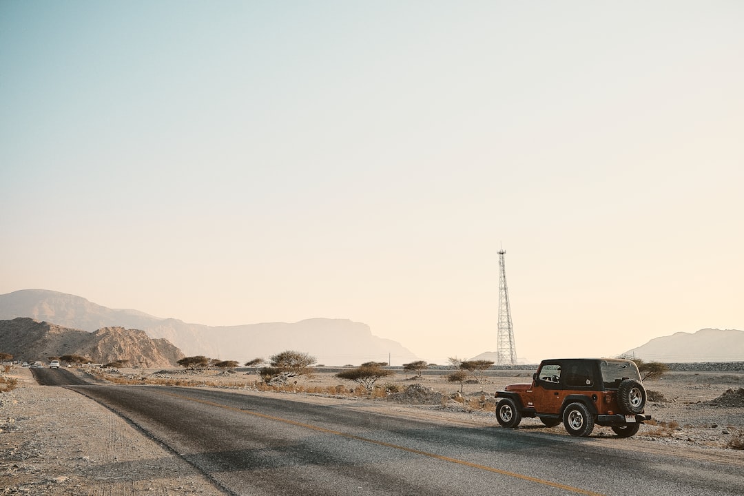 black suv on road during daytime