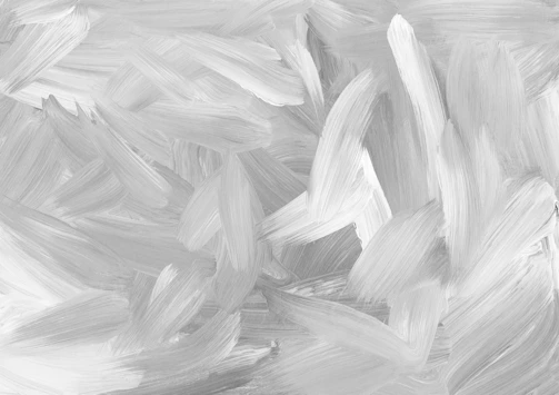 A vertical artwork showing subtle gradations of grey with heavy impasto creating a tactile surface.