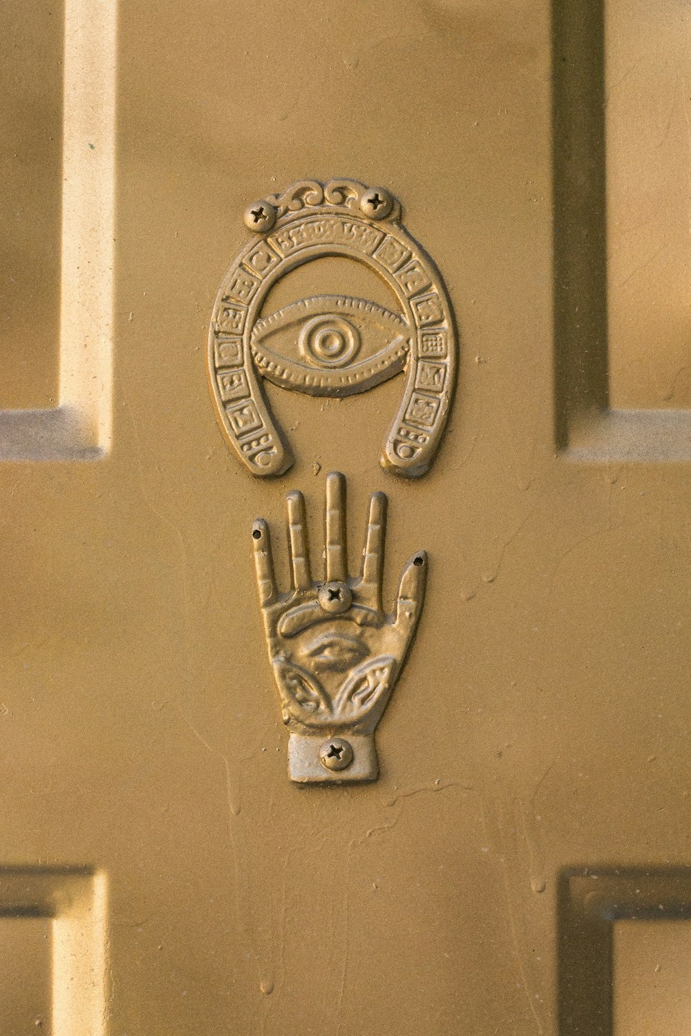 gold lion door handle on blue wooden door