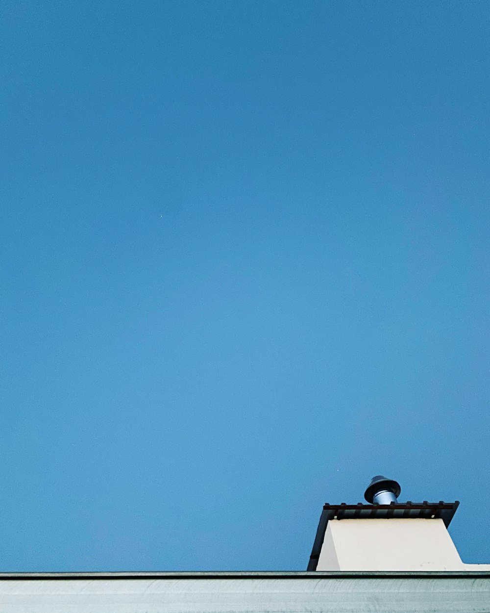 black and white house under blue sky during daytime