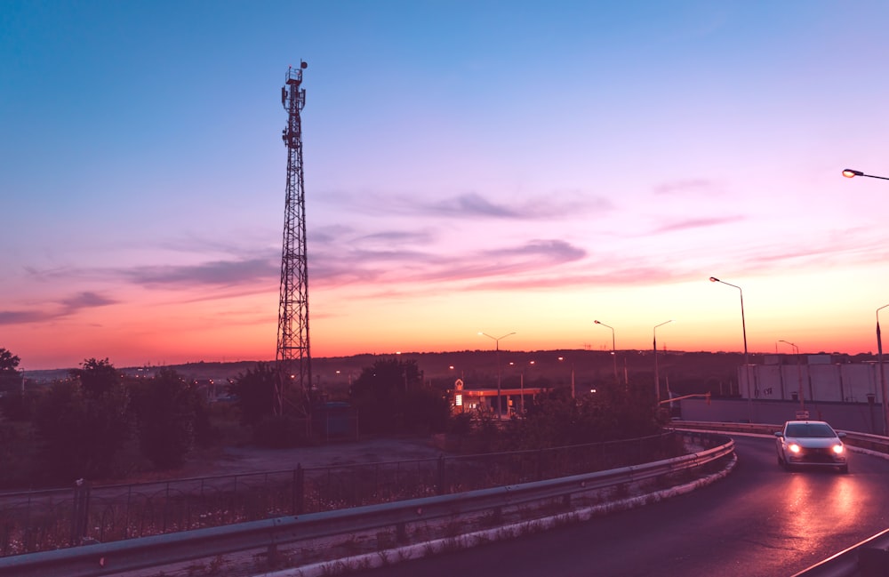 black metal tower during sunset