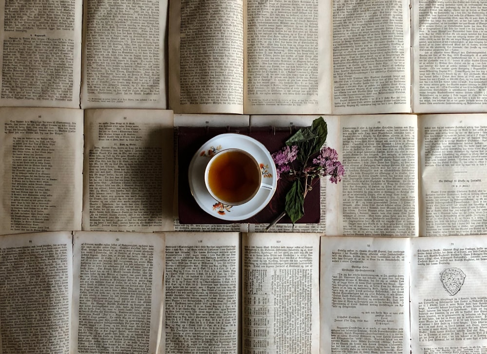 white ceramic cup on white book page