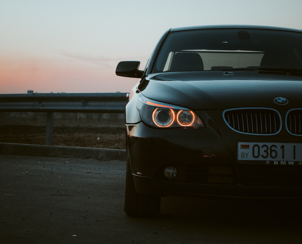 black bmw car on road during daytime