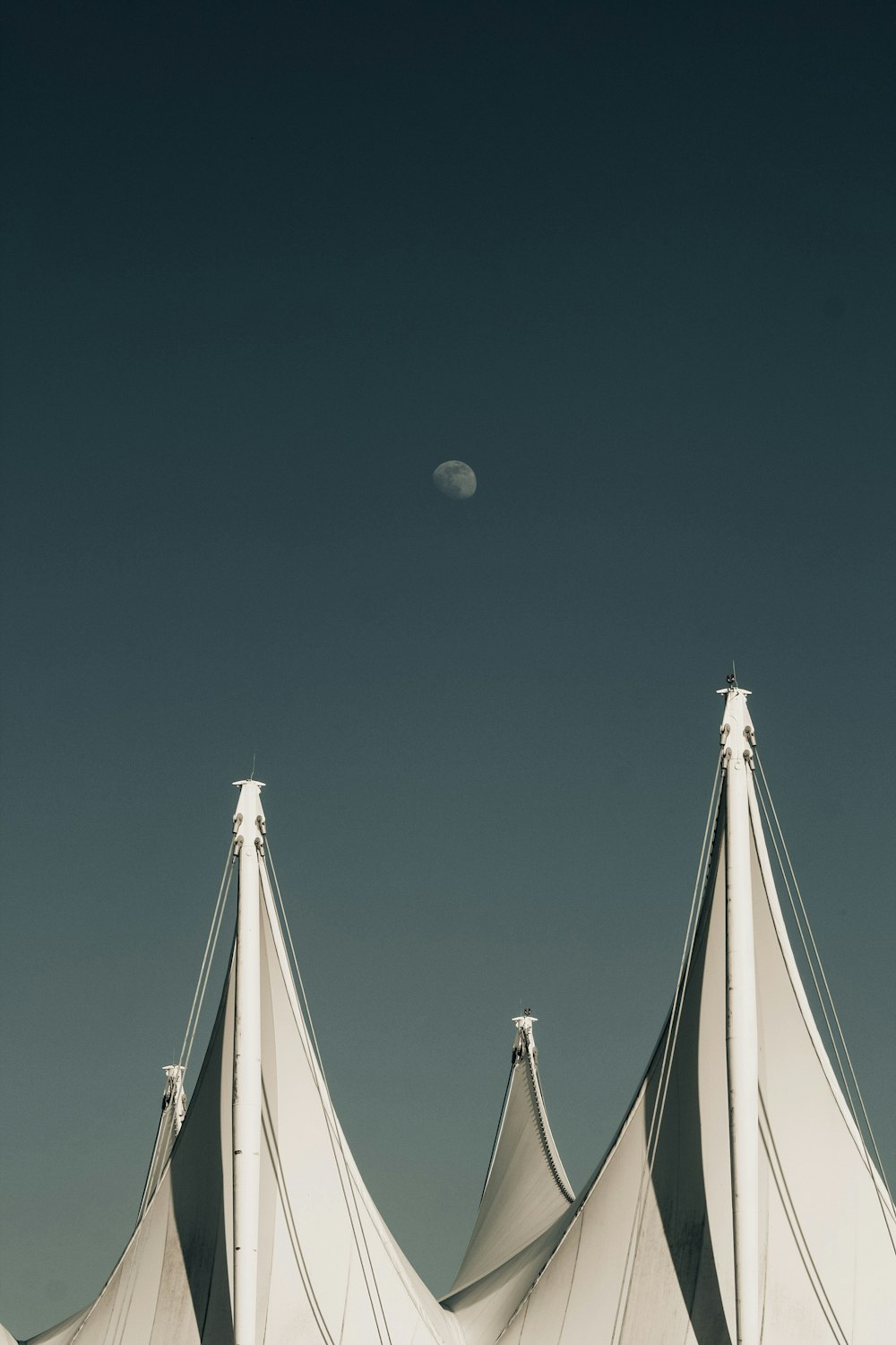 white sail boat on body of water during daytime