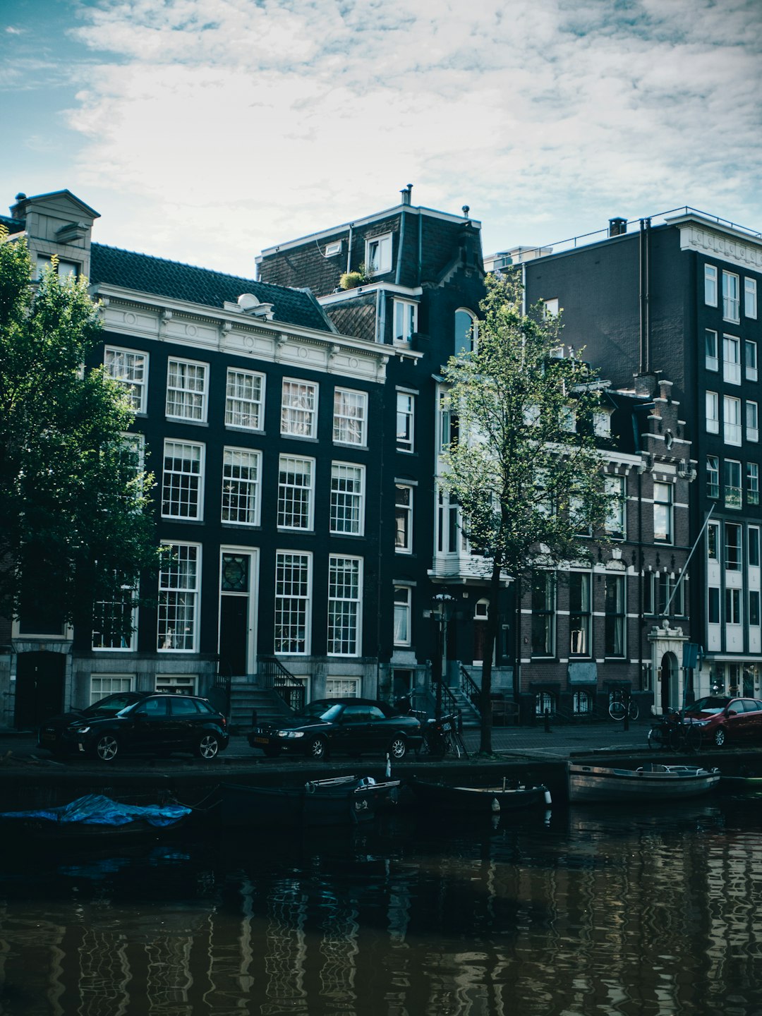 cars parked in front of building during daytime