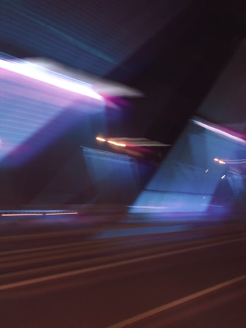 A dynamic scene of urban architecture distorted with vibrant AI-generated color overlays and layered textures.