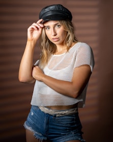 woman in white and black polka dot shirt and blue denim jeans