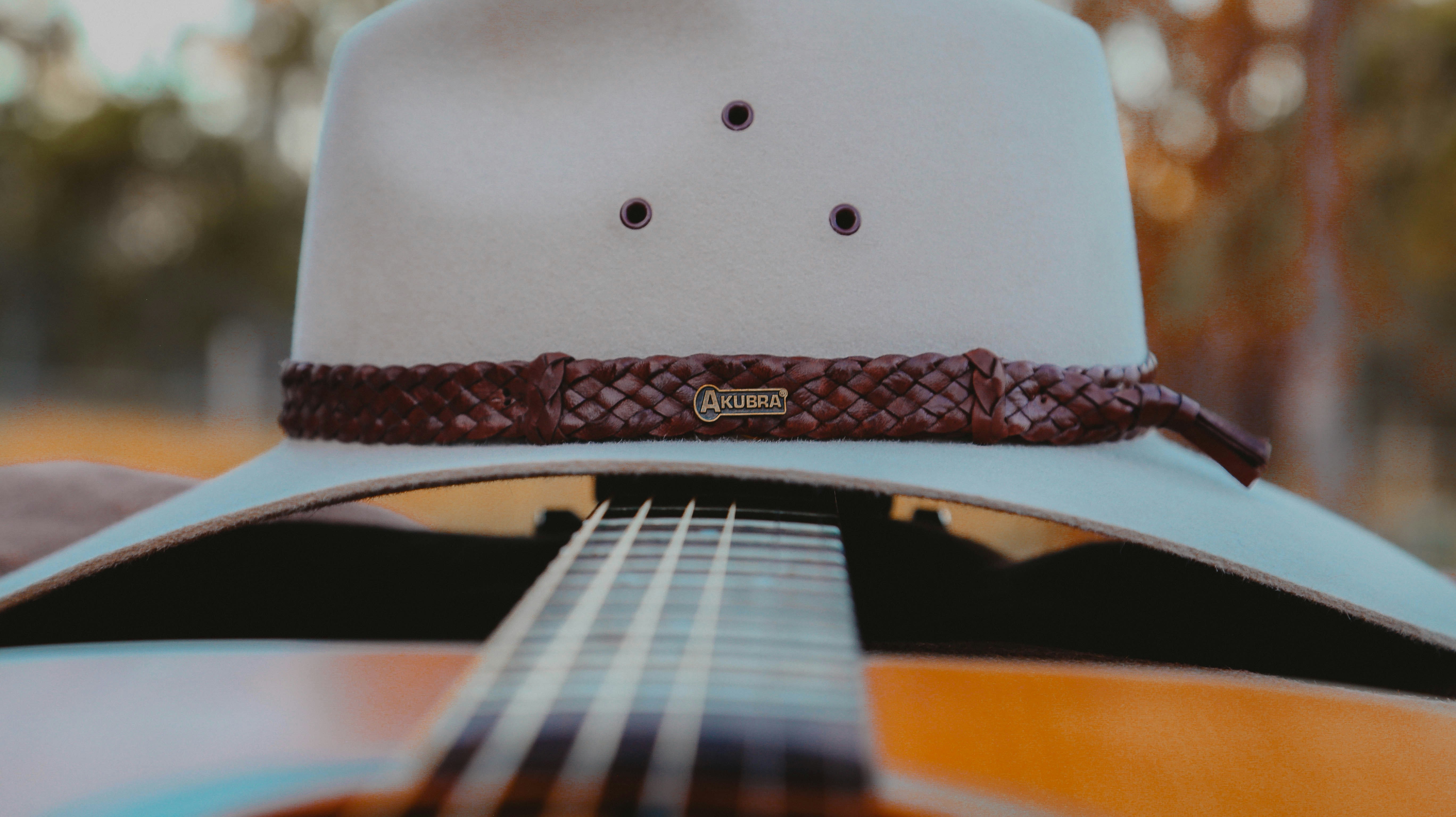 brown and black acoustic guitar
