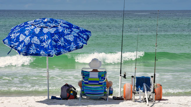 blue and yellow umbrella on beach