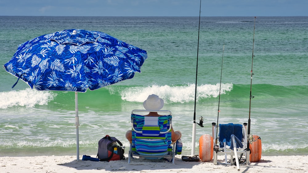 blue and yellow umbrella on beach