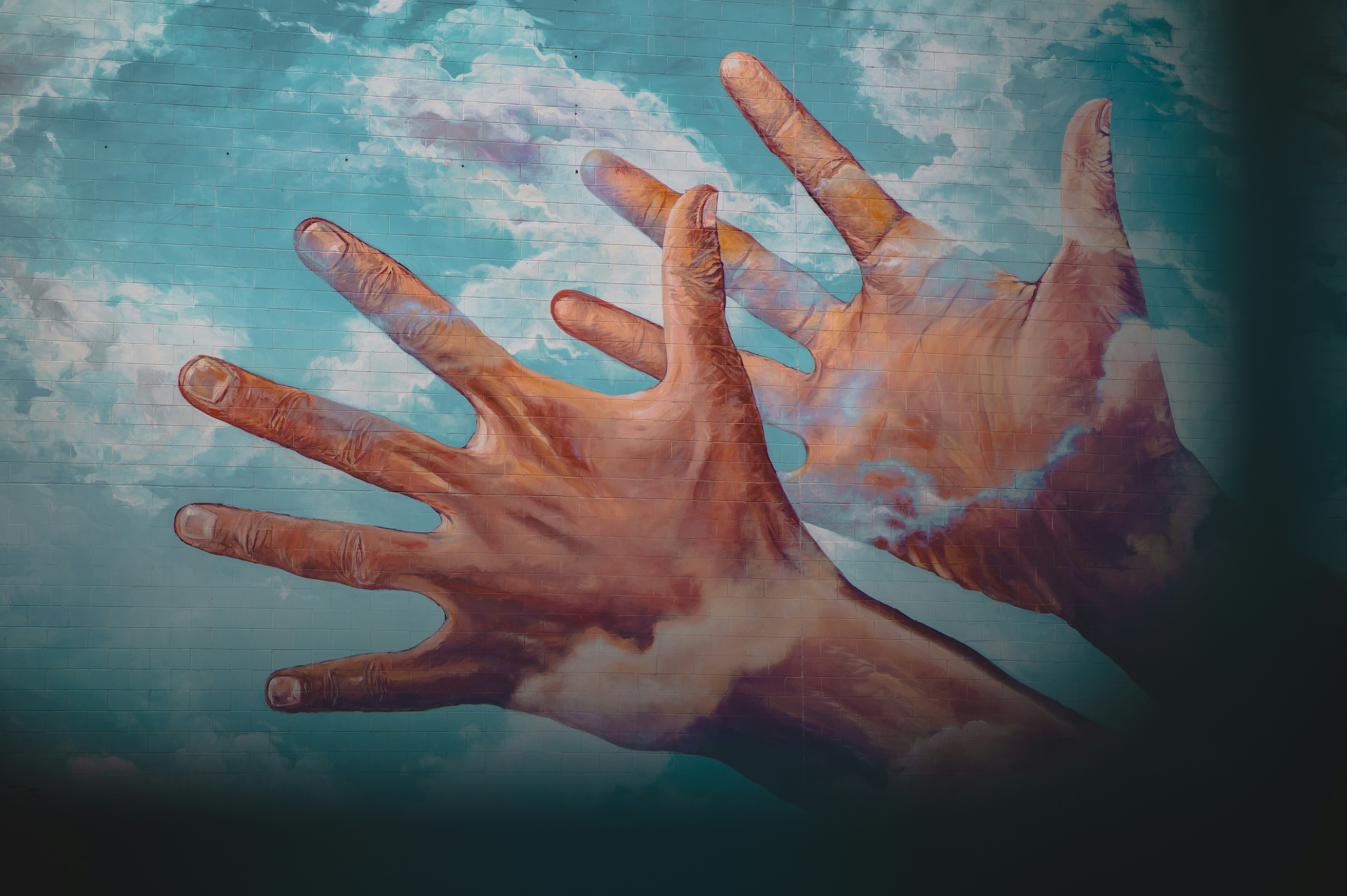 persons hand with blue and white water