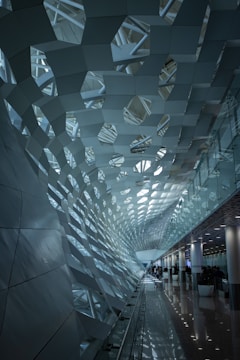 Architectural shot of perforated metal ceiling in a bright interior space.