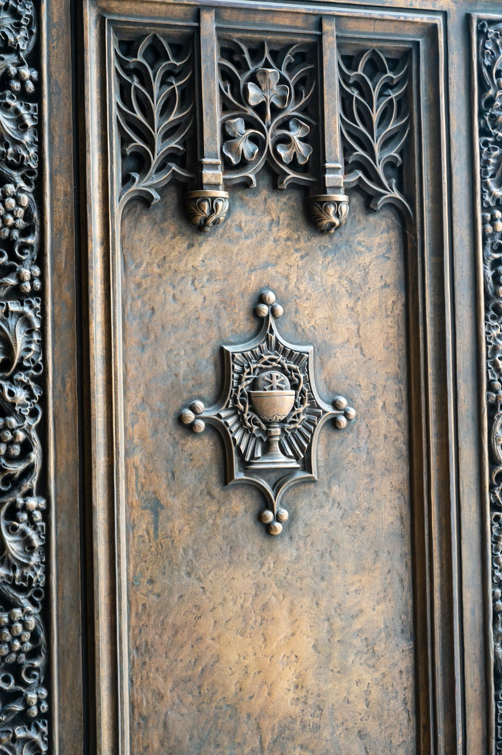 brown wooden door with silver door lever