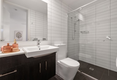 white ceramic sink with stainless steel faucet