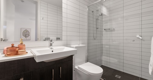 white ceramic sink with stainless steel faucet