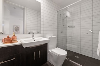 white ceramic sink with stainless steel faucet
