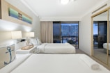 white bed linen on bed