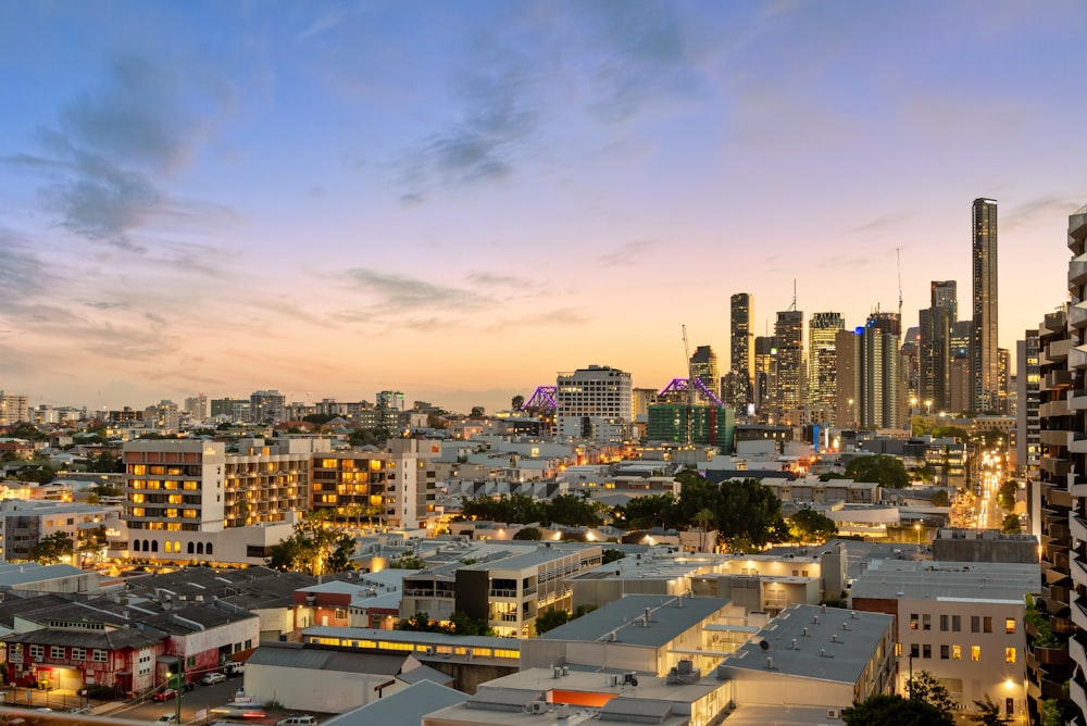 city with high rise buildings under blue sky during daytime