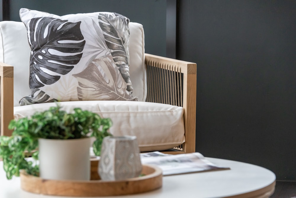 white throw pillow on white sofa chair