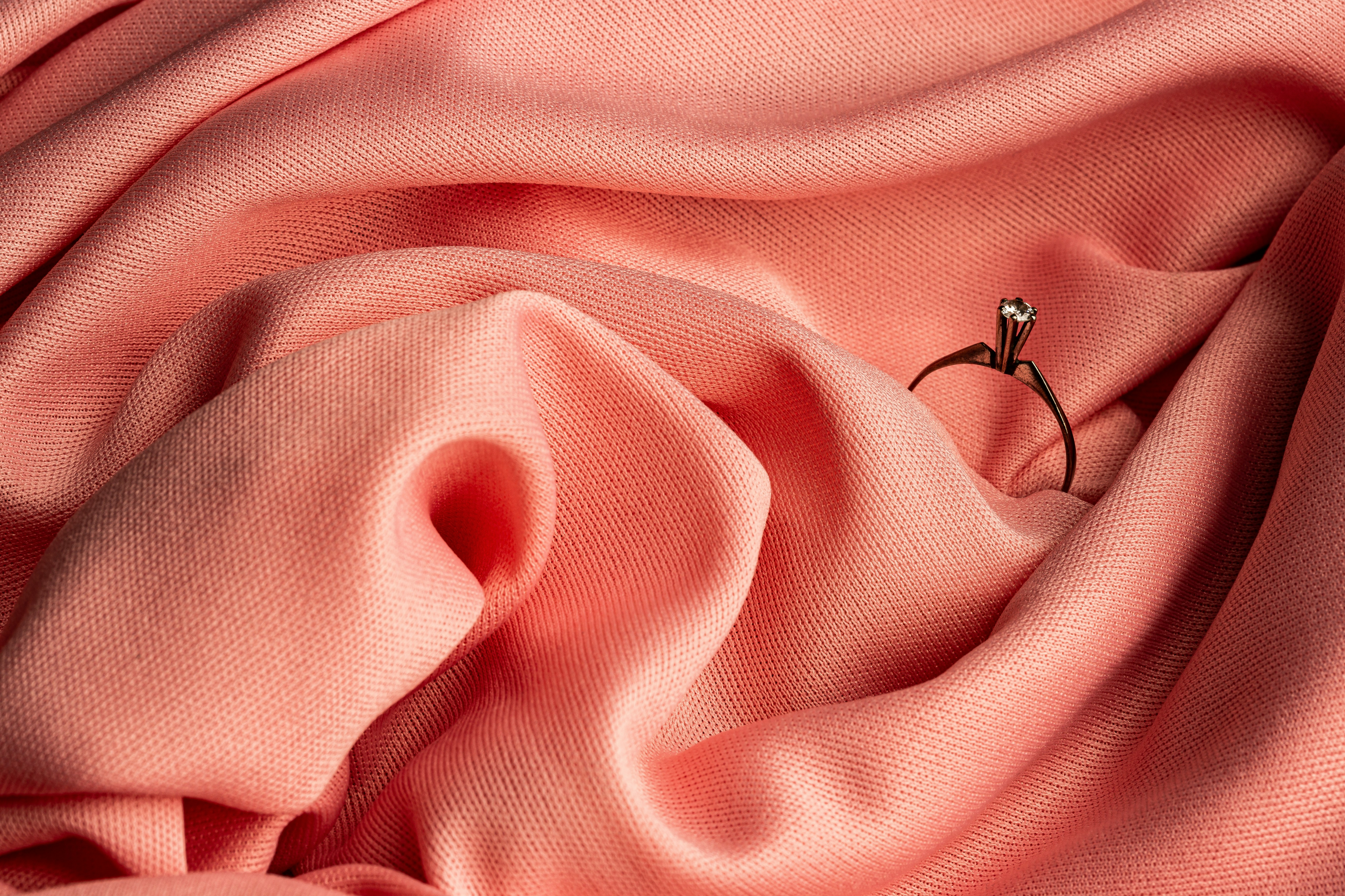 pink textile with silver heart pendant