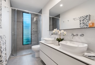 white ceramic sink with mirror