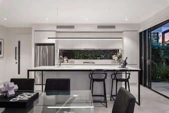 A modern kitchen with sleek cabinets and a spacious island.