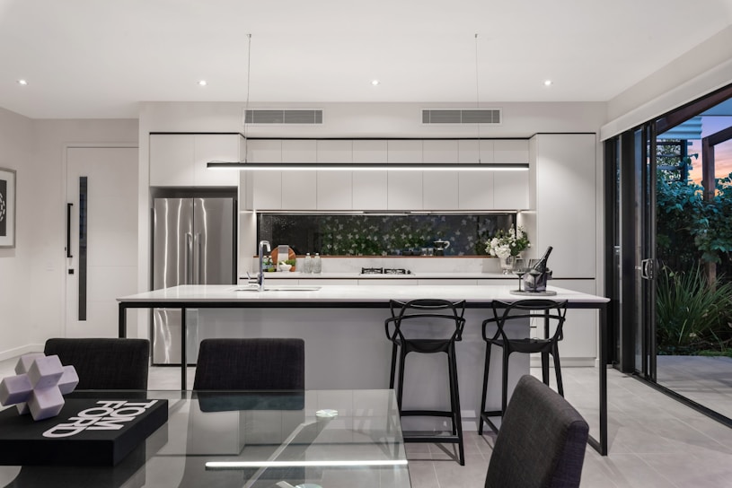 A modern kitchen with sleek cabinets and a large island.