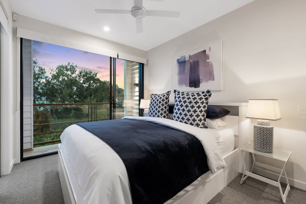 white bed with blue bed linen