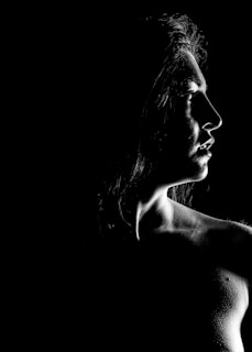 A striking portrait of a model on a runway showcasing dynamic lighting and sharp focus.