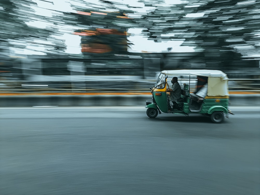 green and white golf cart on road during daytime