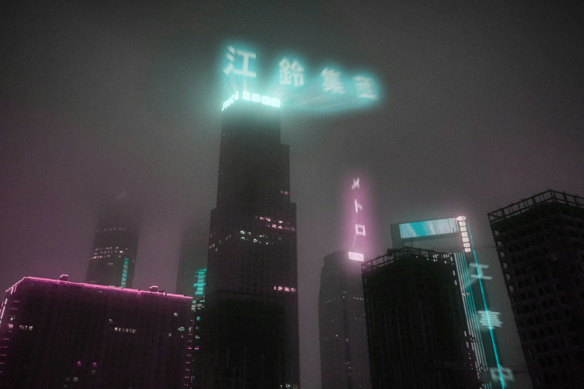 A neon-lit cityscape at night with towering skyscrapers and flickering holographic ads, capturing the essence of a dark cyberpunk world.