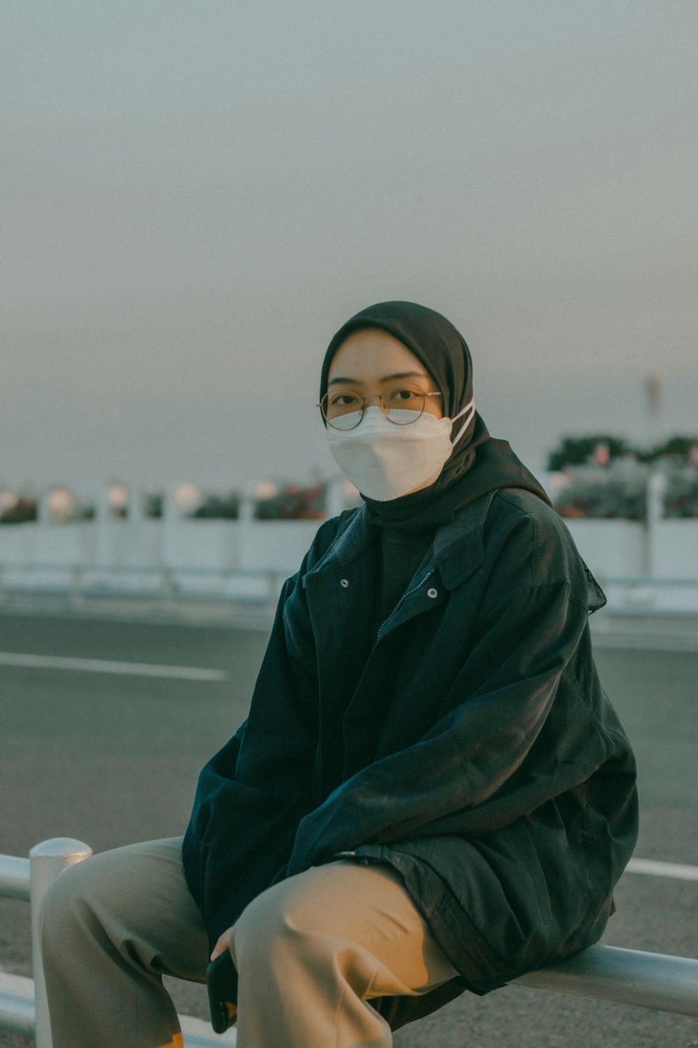 woman in green hoodie wearing white hijab