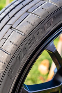 black car wheel in close up photography