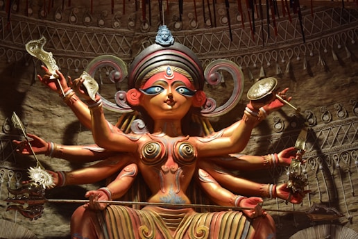 brown and green wooden statue